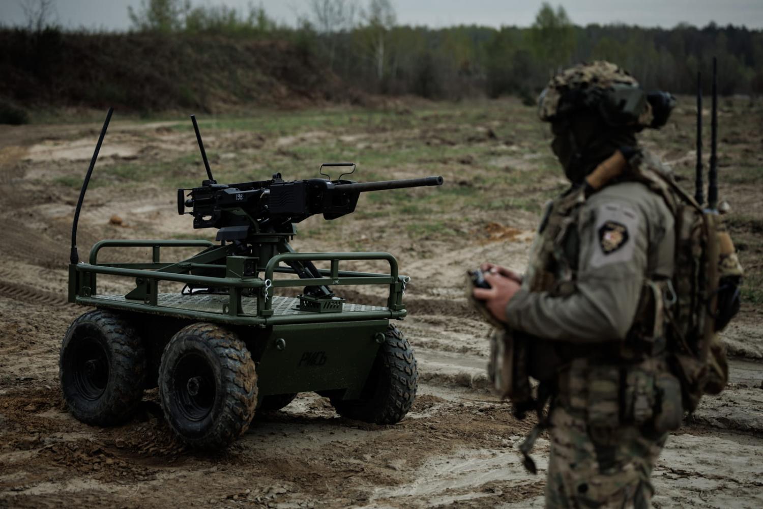 A ground robot equipped with tracks transporting equipment on the Ukrainian front line.